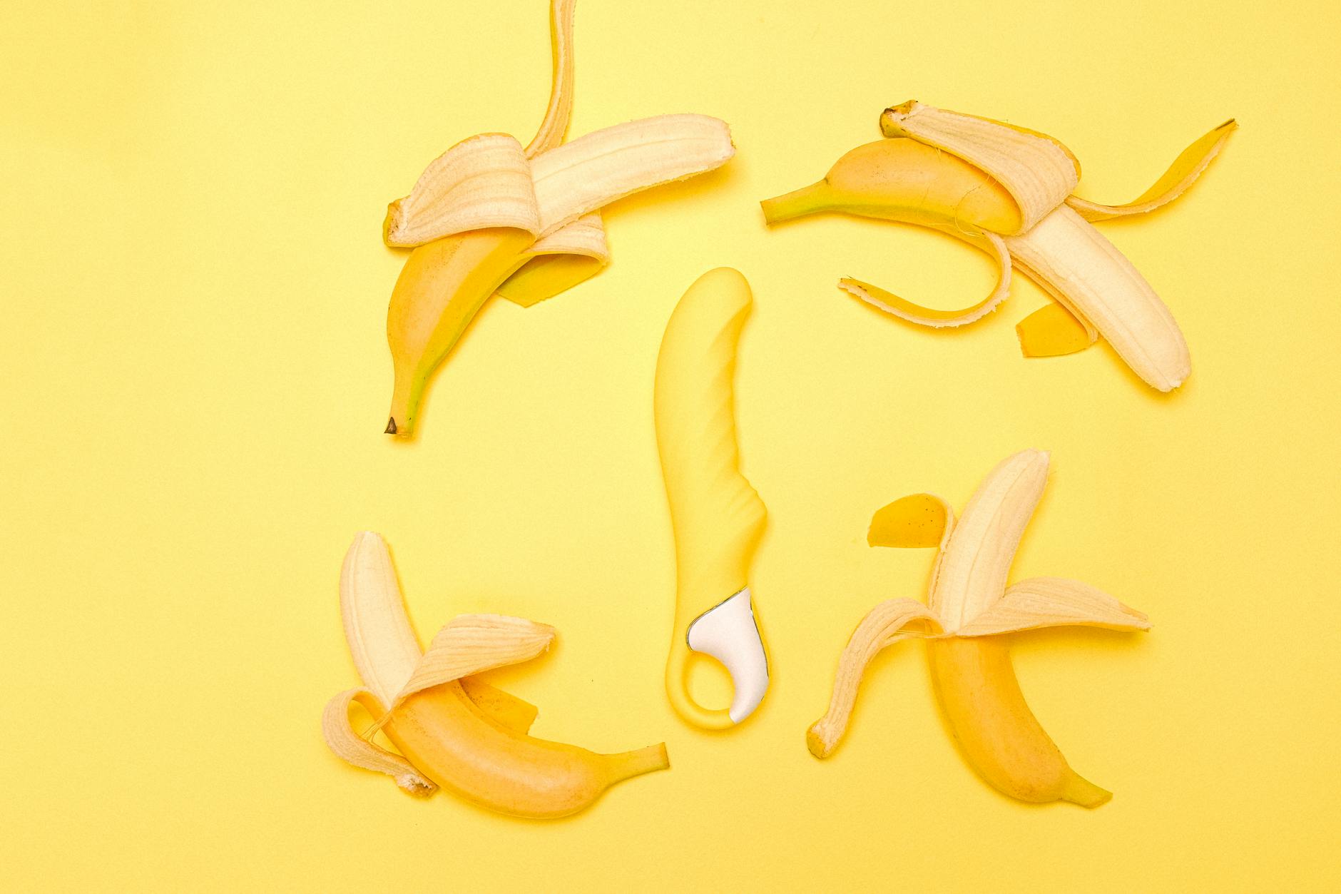 Yellow lemon vibrator on soft yellow background symbolizing gentle return to pleasure